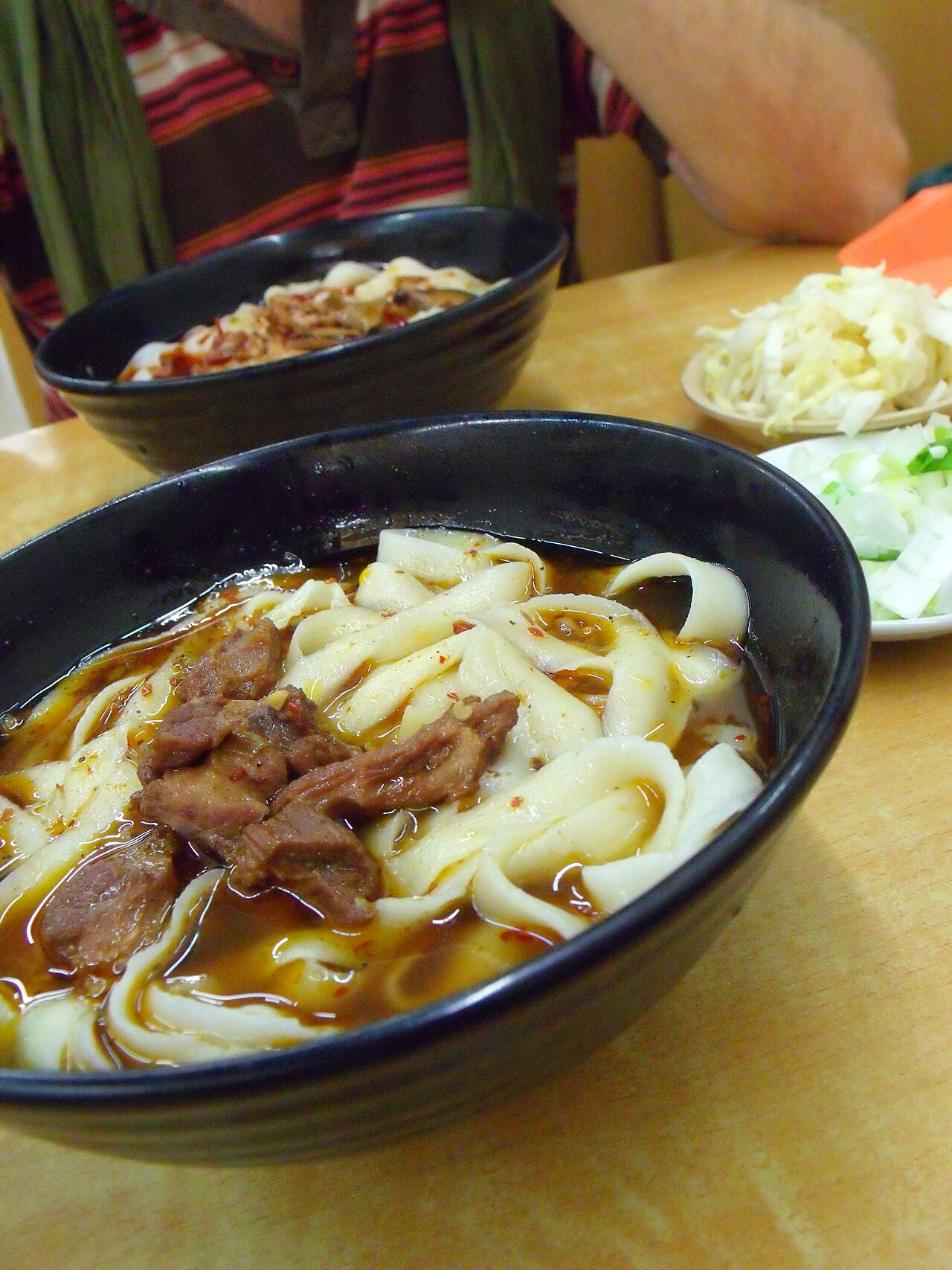 A photograph of Datong knife-shaved noodles